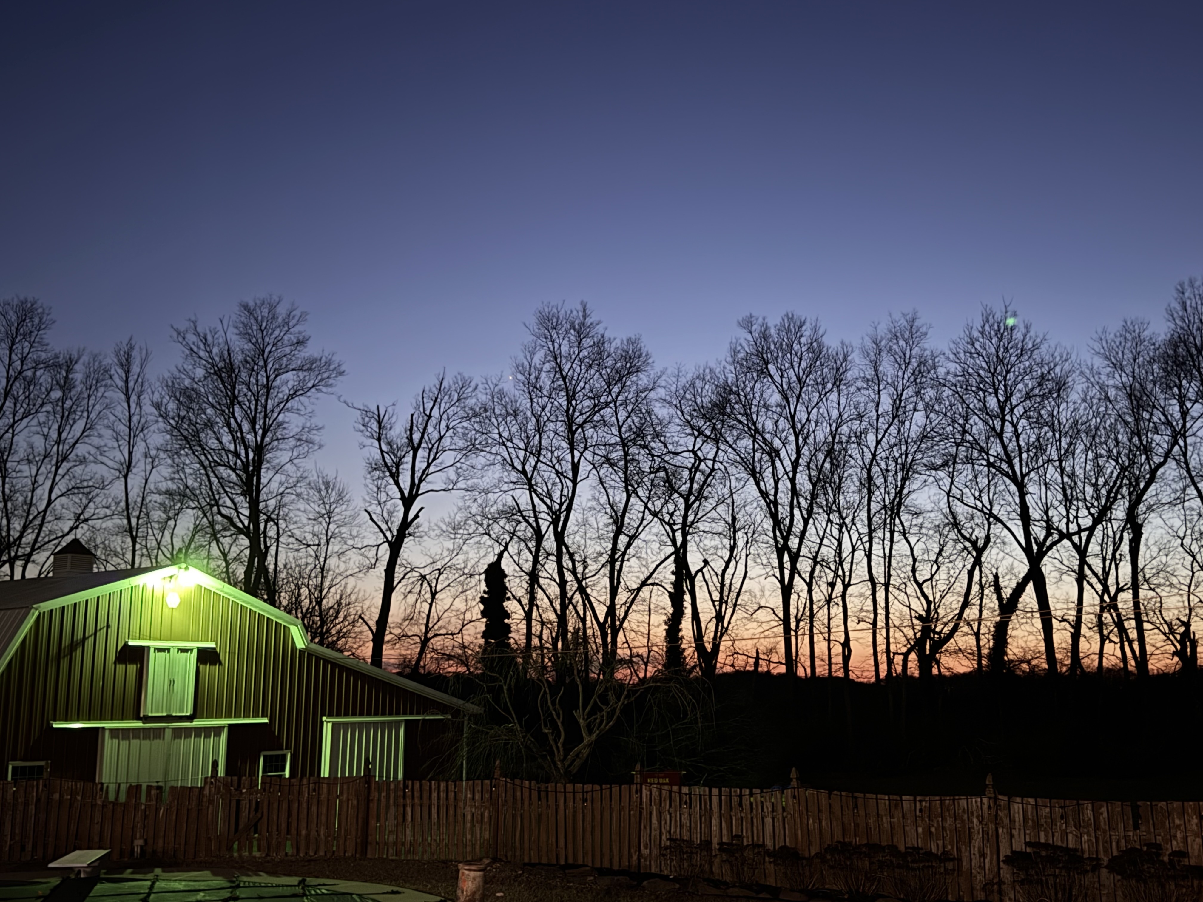 The barn glowing at sunset at Zen Den Farm